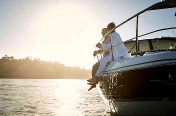 couple on boat at sunset